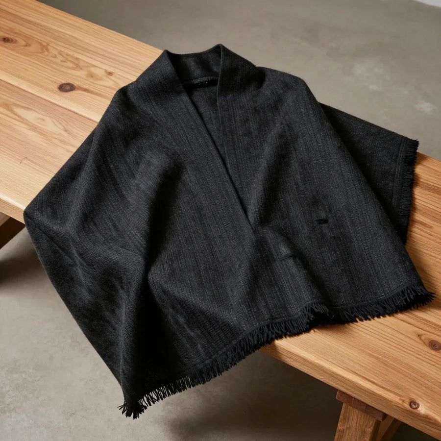 Black Tent Cloak by ALPORA, a large woven yak-hair cloak-wrap using the waterproof black tent weaving technique of tibetan nomads, wearable or draped