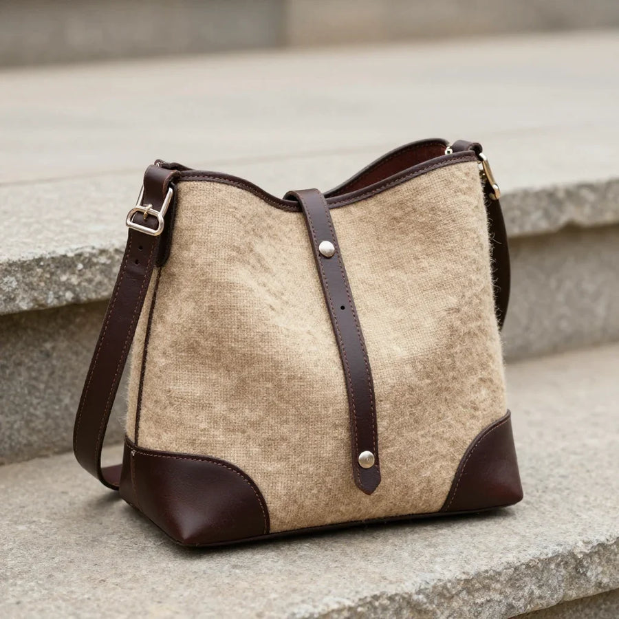 Nomad Pack Bag by ALPORA, a shoulder bag combining vegetable-tanned leather with handwoven wool panels, translating the tibetan nomadic pack saddle bag