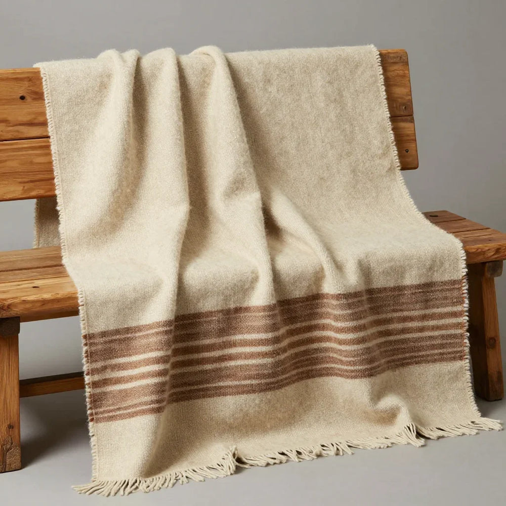 Pulu Draped Wrap by ALPORA, a wide pulu draped wrap in natural undyed wool with earth-tone stripes, the multi-purpose tibetan textile worn from daily warmth to ceremony