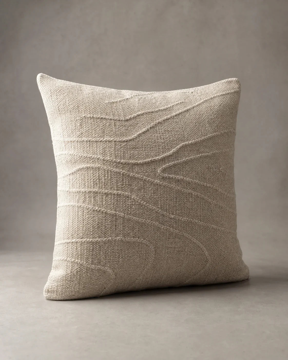 Traverse Contour Wool Cushion by ALPORA, a tactile wool cushion traced with quiet raised lines inspired by changing terrain